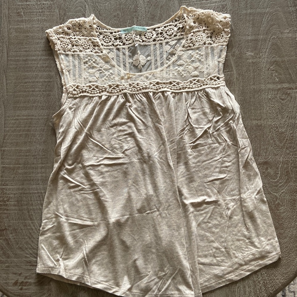 Like new adorable tank top. Buttons on the back and crocheted lace top.